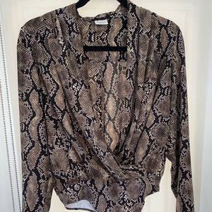 Animal print/leopard print bodysuit really cute to go to work or go out in.